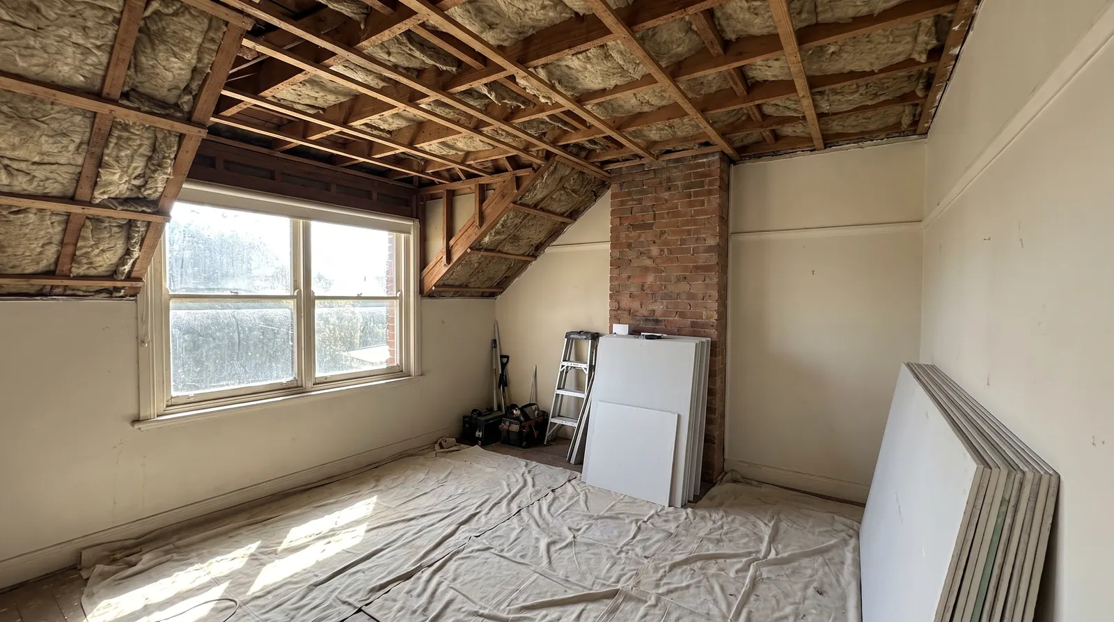 Old ceiling removed exposing timber joists, drop sheets down and new plasterboard sheets ready, Perth bedroom